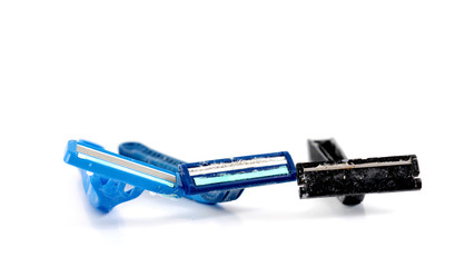 used shaving razor on a white brown background