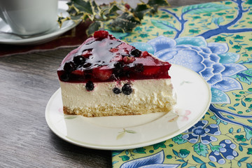 Slice of delicious tasty cheesecake with berry