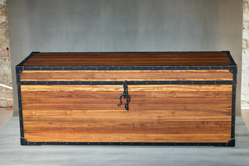 Solid teak chest. Wooden storage chest with metal frames on the corners