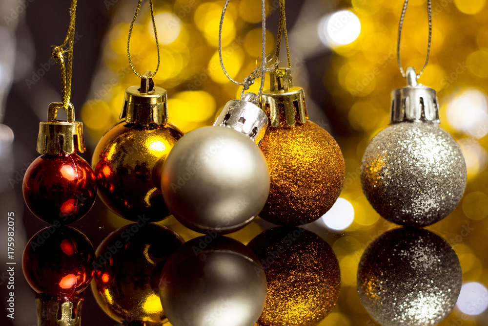 Wall mural christmas decoration on a golden background. bokeh background and dark mirror floor.
