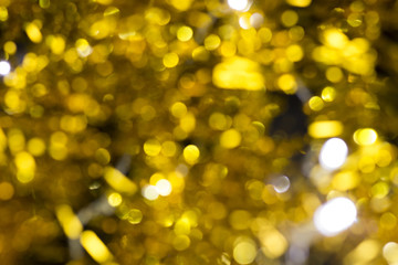 Christmas decoration on a golden background. bokeh background and dark mirror floor.