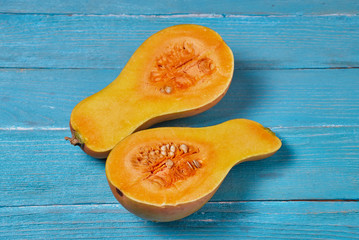 Fresh pumpkin on rustic blue wooden background