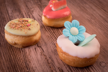 Multicolored donuts on the table
