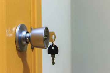 Key in keyhole on door