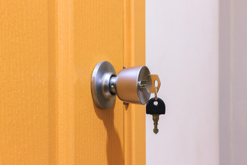 Key in keyhole on door