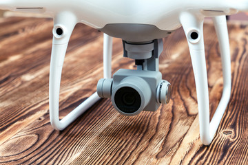 white drone isolated on a wooden background