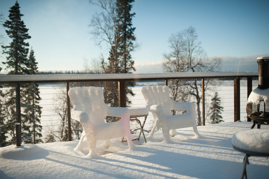 snow covered chairs