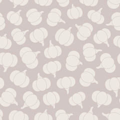 Colorful vector seamless pattern with orange pumpkins silhouettes on the gray background. Abstract autumn ornament.