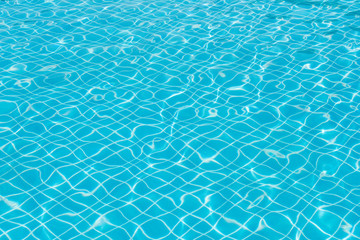 Beautiful ripple wave and blue water surface in swimming pool, Bright water and blue tile in pool for background and abstract