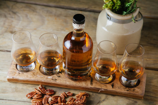 Whiskey Flight On Rustic Background