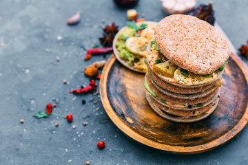 Variety of mini sandwiches with vegetableson a light background, top view. Flat lay