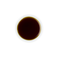 Soy sauce in white bowl isolated on white