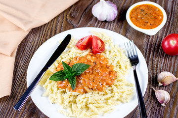 Macaroni pasta spiced with oregano and basil herbs, ready to eat with tomato and garlic sauce