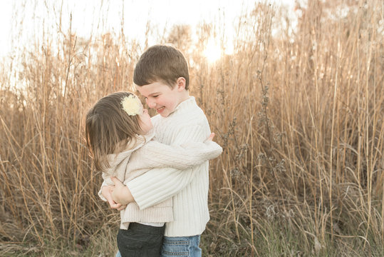 Brother And Sister Hugging