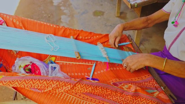 MAE HONG SON, THAILAND-APRIL 17 Long necked Karen women weaving show tourist in Huy Saur Tao village on 16 April, 2016 Mae Hong Son, Thailand