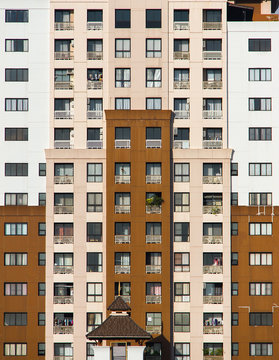 Building exterior with many apartment windows.
