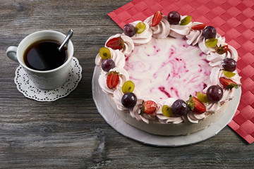 Delicious tart with fresh grapes, strawberries and whipped cream