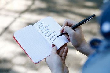 A small notebook with a list of groceries