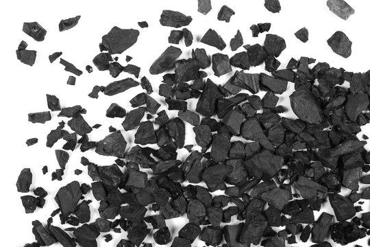 Pile black coal isolated on white background, top view
