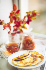Romantic Breakfast by the window - pancakes and tea