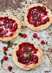 Homemade pie (galette) with raspberries, top view