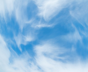 Naklejka na ściany i meble White feather clouds in the blue sky
