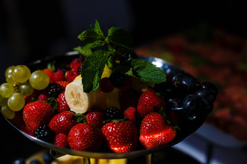 Tasty mix berry in bowl on white background