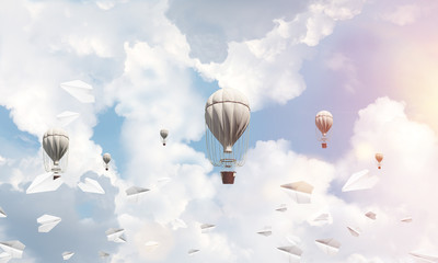 Flying hot air balloons in the air.