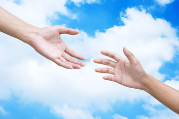 couple of helping/praying hand skies background,support/ aid/love/trust / healthcare/ therapy/healing /affection / friends and family concept.