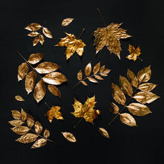 Autumn composition. Pattern made of autumn golden  leaves on  black background. Flat lay, top view,...