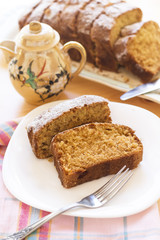 sweet almond homemade cake on white plate with coffee