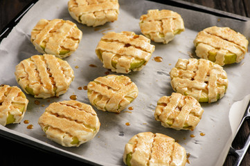 Puff pastries with apple and cinnamon. Baking process.