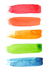 Set of five colorful brush strokes painted in watercolor on clean white background