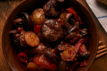 Baked vegetables, potatoes, mushrooms, onion, tomato and garlic