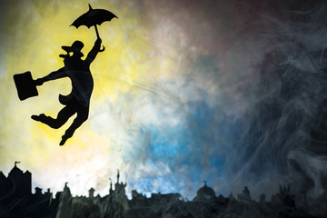 man is flying with an umbrella