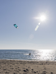 bold kitesurfer riding the waves