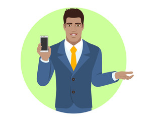 Businessman holding mobile phone and  gesturing