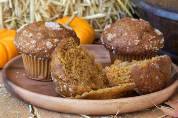 Delicious Pumpkin Muffins on a Wooden Plate