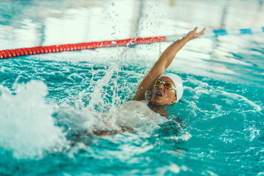 Female swimmer on training in the swimming pool