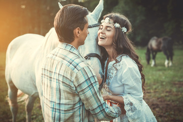 Fototapeta premium Happy couple and beautiful horse