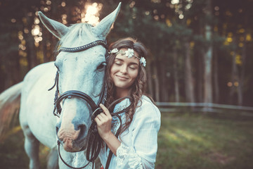 Beautiful young woman and horse