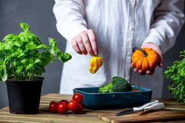 Caucasian woman cooking vegetables for a dinner