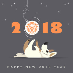 Cute dog plays with Christmas ball. Happy 2018 new year. Holidays greeting card.