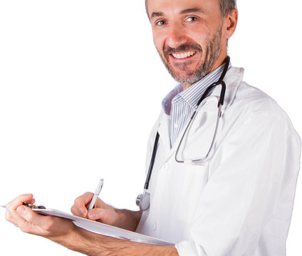 Handsome doctor smiling while writing a prescription isolated on white 