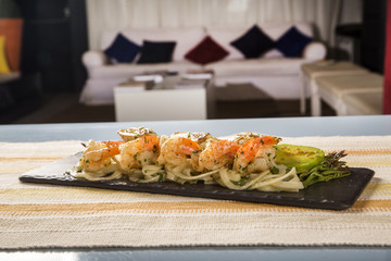 Delicious spaghetti salad with shrimp, tomato and pupunha palm