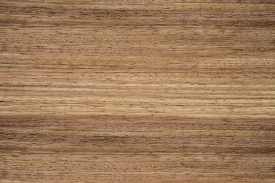 Texture of wood with a natural pattern. Red tree. Veneer.