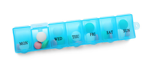 Container with pills on white background