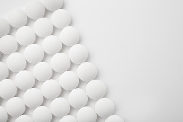 Round pills on white background