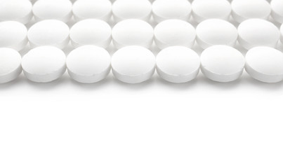Round pills on white background