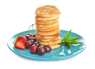 Plate with tasty pancakes and berries isolated on white